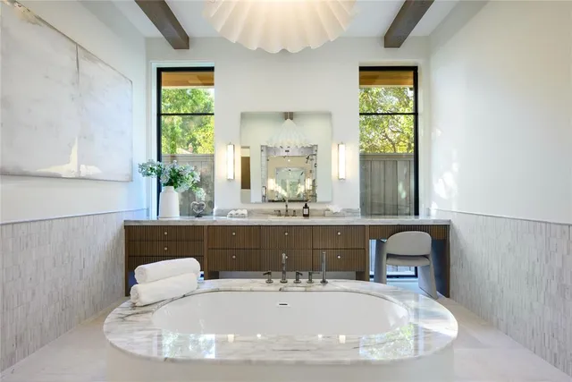 a view of a dining room with a table and chairs
