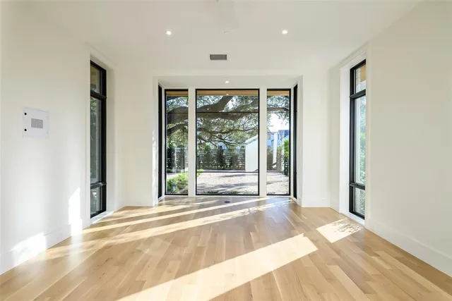 a view of an entryway with wooden floor