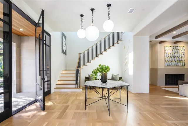 a view of a livingroom with furniture and a potted plant