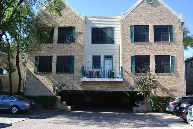 a view of a house with a balcony and a fireplace