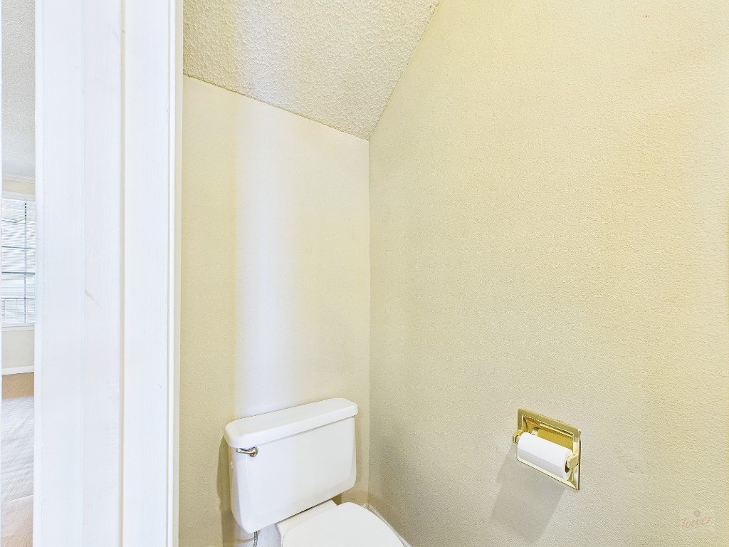 2300 Leon Street, Unit 204 Austin, TX 78705 - Photo 12 of 31 a white toilet sitting next to a white wall