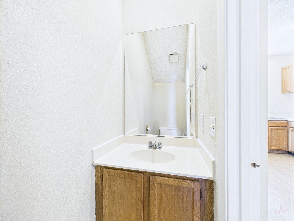 2300 Leon Street, Unit 204 Austin, TX 78705 - Photo 13 of 31 a bathroom with a sink and a mirror