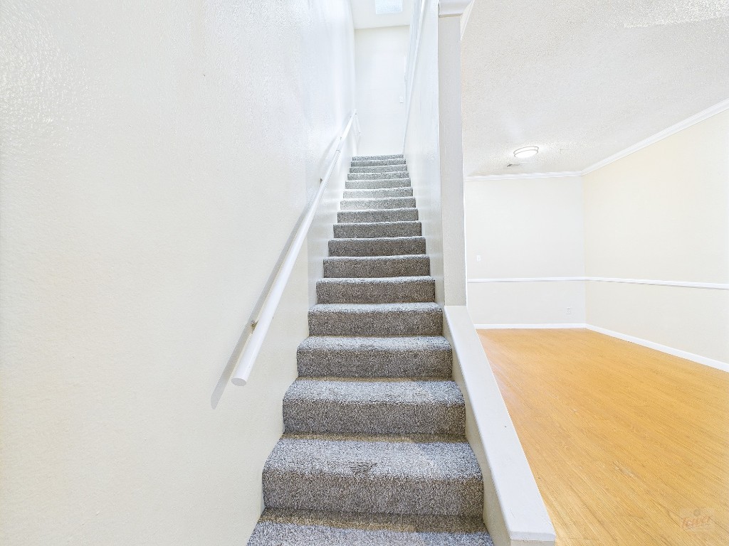 2300 Leon Street, Unit 204 Austin, TX 78705 - Photo 15 of 31 a view of staircase with white walls