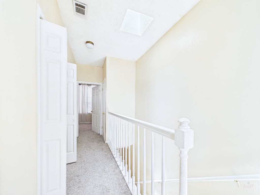 2300 Leon Street, Unit 204 Austin, TX 78705 - Photo 17 of 31 a view of a hallway with a white walls