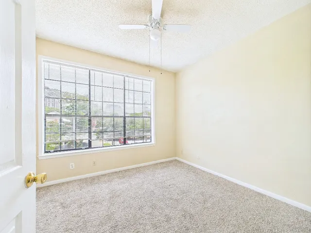 a view of an empty room with a fireplace