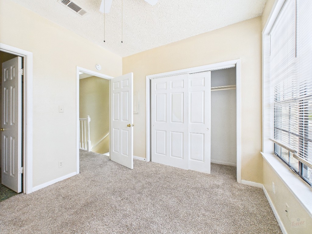 2300 Leon Street, Unit 204 Austin, TX 78705 - Photo 19 of 31 a view of an empty room with a fireplace