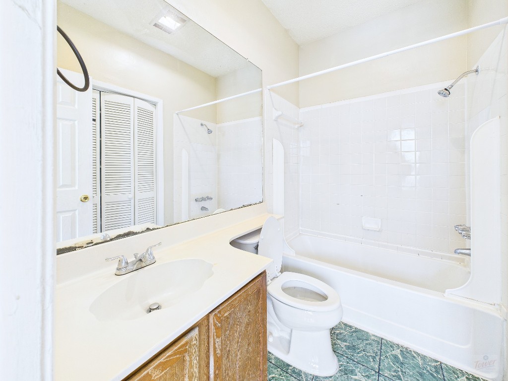 2300 Leon Street, Unit 204 Austin, TX 78705 - Photo 20 of 31 a bathroom with a sink a toilet and a bathtub