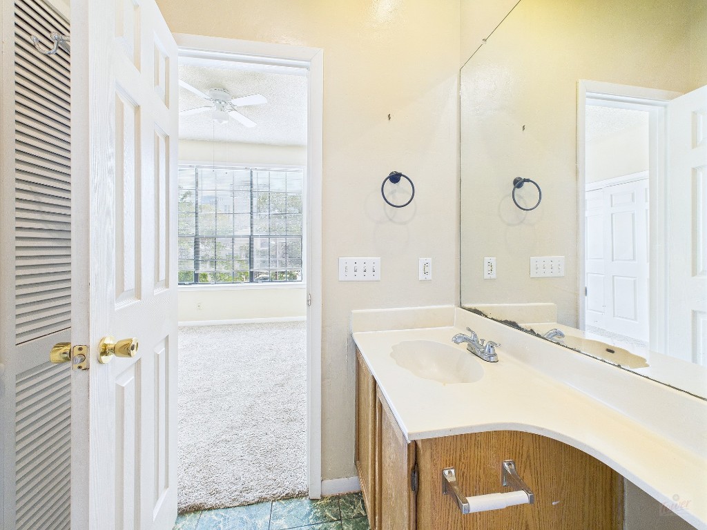 2300 Leon Street, Unit 204 Austin, TX 78705 - Photo 21 of 31 a bathroom with a sink and a mirror
