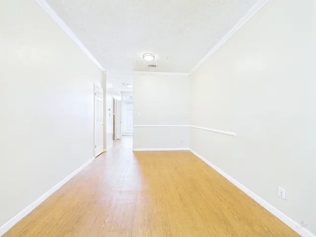 a view of a big room with wooden floor