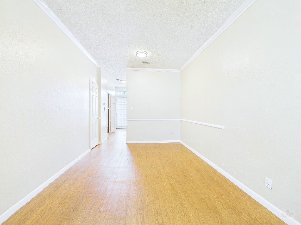 2300 Leon Street, Unit 204 Austin, TX 78705 - Photo 4 of 31 a view of a big room with wooden floor