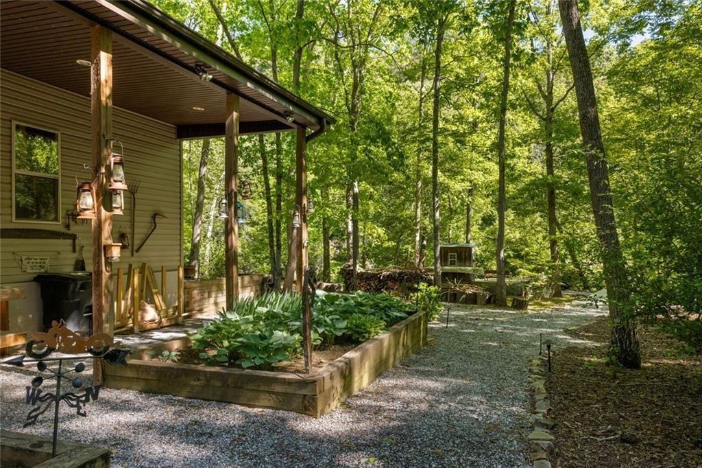 704 Riverbend Road Blairsville, GA 30512 - Photo 11 of 89 a backyard of a house with lots of green space