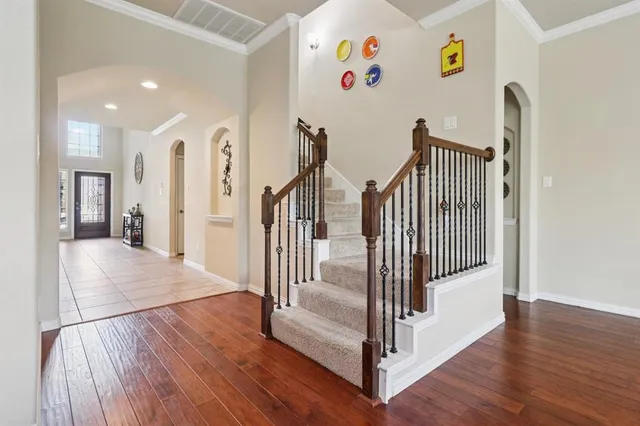 a view of entryway with stairs and wooden floor