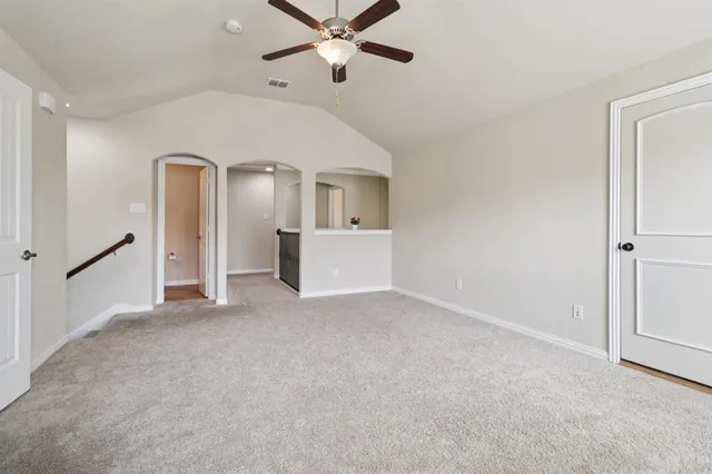 a view of a big room with closet and windows