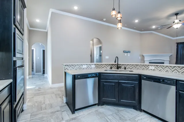 a kitchen with a sink and a refrigerator