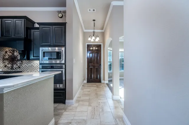 a view of a kitchen from the hallway