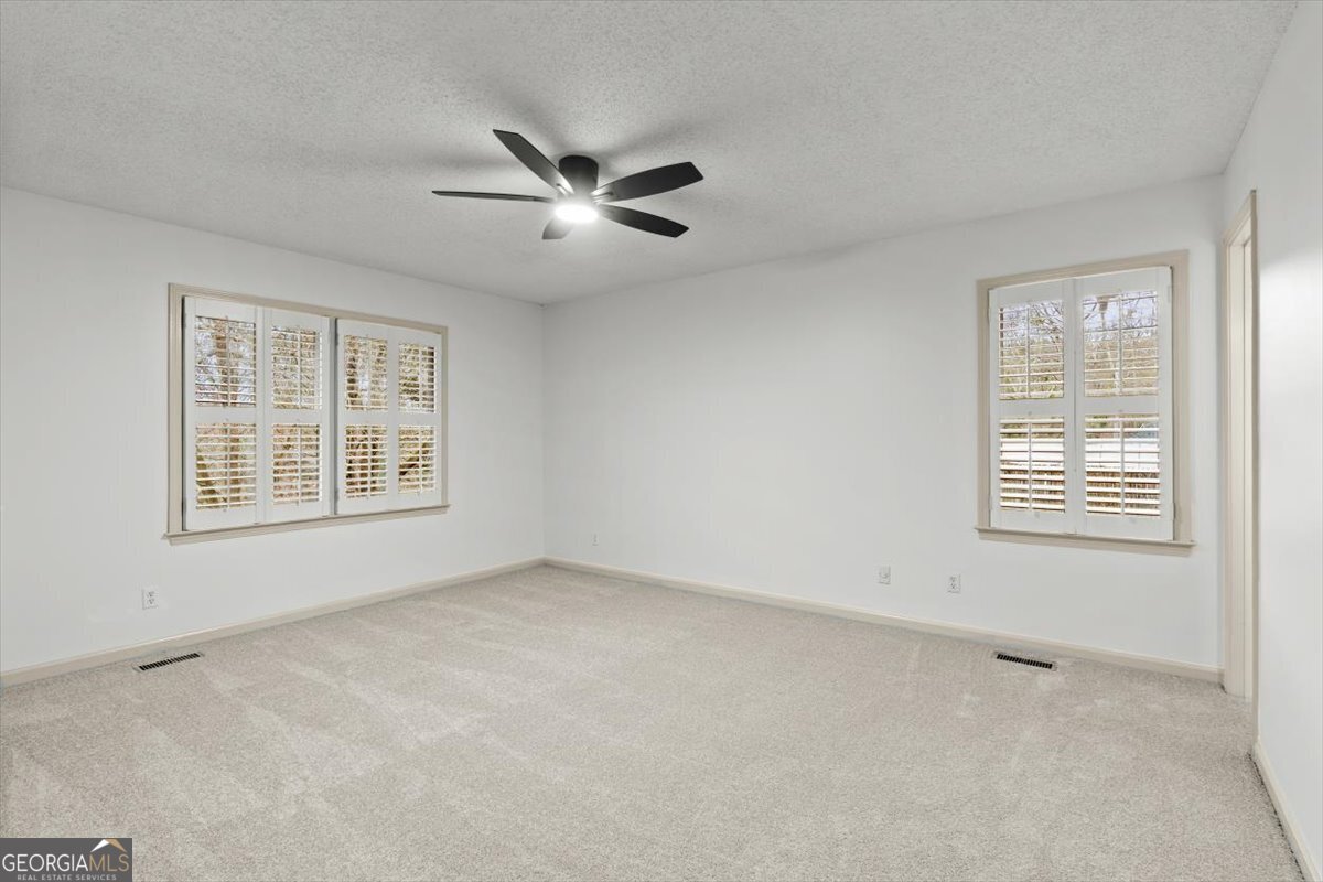 325 Almon Road Carrollton, GA 30117 - Photo 14 of 41 a view of an empty room with a window