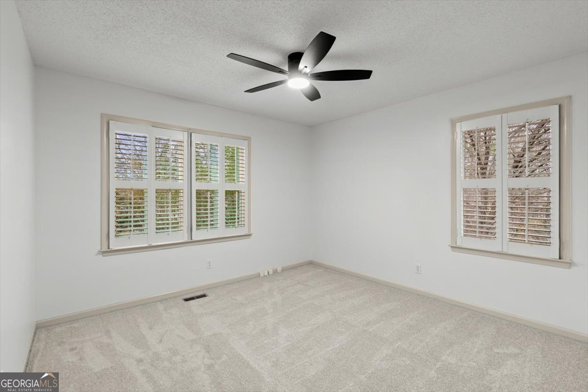 325 Almon Road Carrollton, GA 30117 - Photo 19 of 41 a view of an empty room with a window