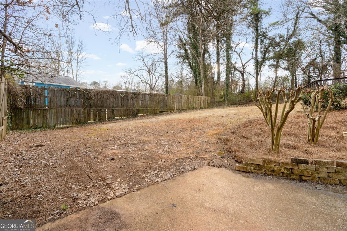 325 Almon Road Carrollton, GA 30117 - Photo 24 of 41 a backyard of a house with lots of green space