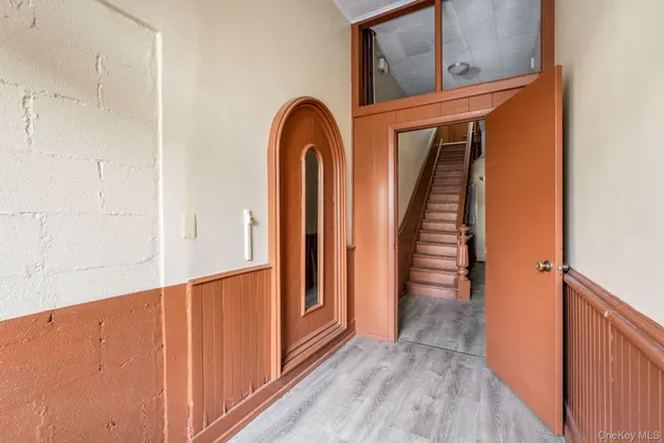a view of front door with wooden floor