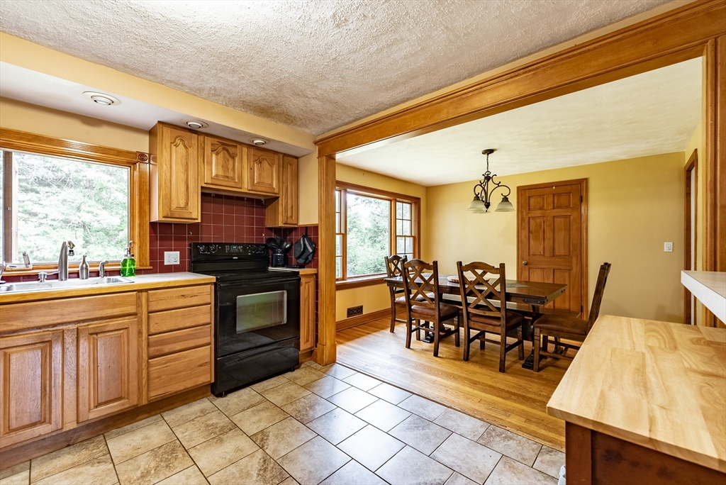 9 Meadowbrook Road Springfield, MA 01128 - Photo 4 of 15 a large kitchen with lots of counter and chairs
