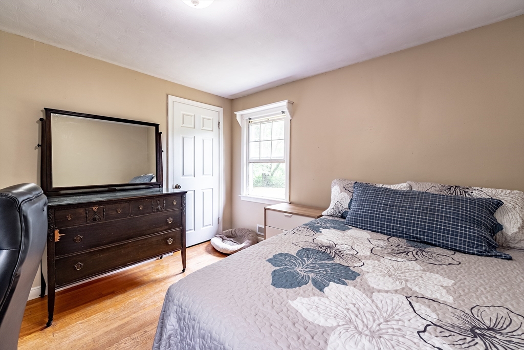 9 Meadowbrook Road Springfield, MA 01128 - Photo 7 of 15 a bedroom with a bed and a flat screen television