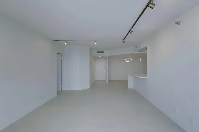 a view of an empty room with a window