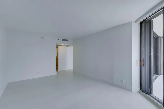 a spacious bathroom with a double vanity sink mirror and toilet