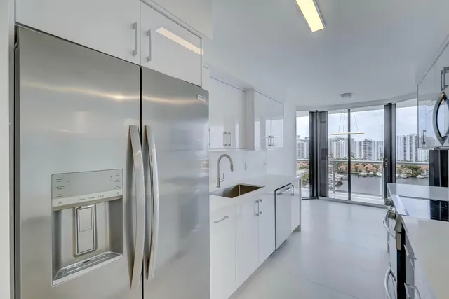 a spacious bathroom with a double vanity sink a mirror and a shower