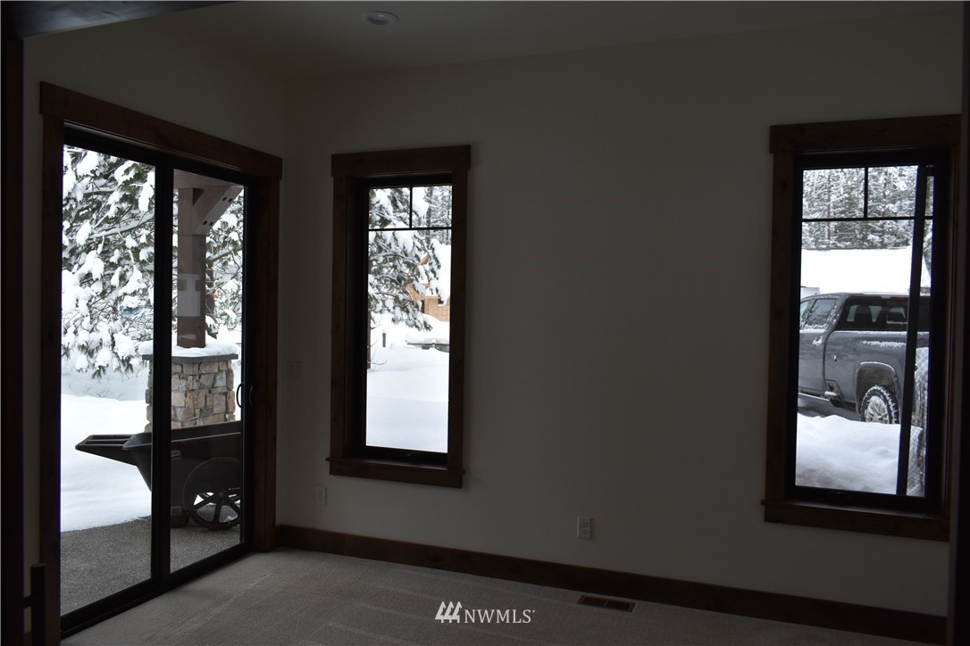 1421 Kokanee Loop Cle Elum, WA 98922 - Photo 22 of 33 a view of front door and bedroom with a window