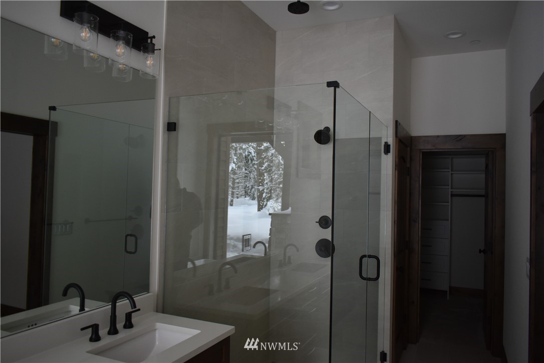 1421 Kokanee Loop Cle Elum, WA 98922 - Photo 25 of 33 a bathroom with a shower and a sink