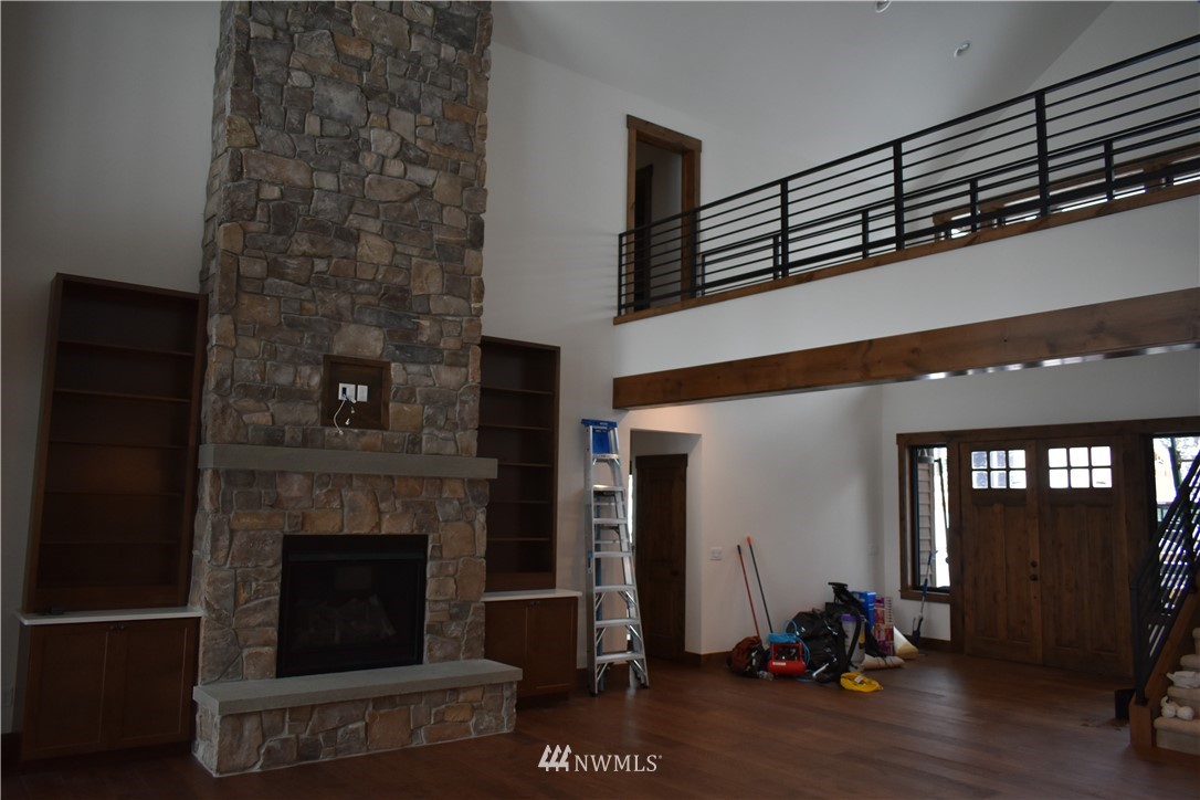 1421 Kokanee Loop Cle Elum, WA 98922 - Photo 4 of 33 a living room with furniture a window and a fireplace