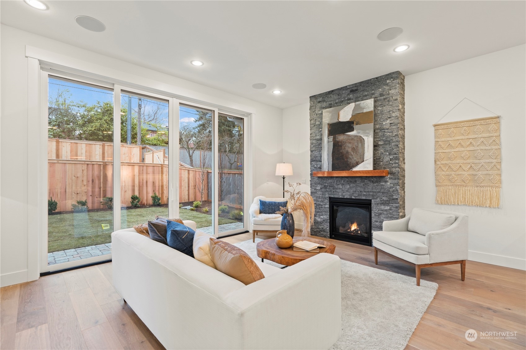 10063 Dibble Avenue Northwest Seattle, WA 98177 - Photo 12 of 35 a living room with furniture and a fireplace