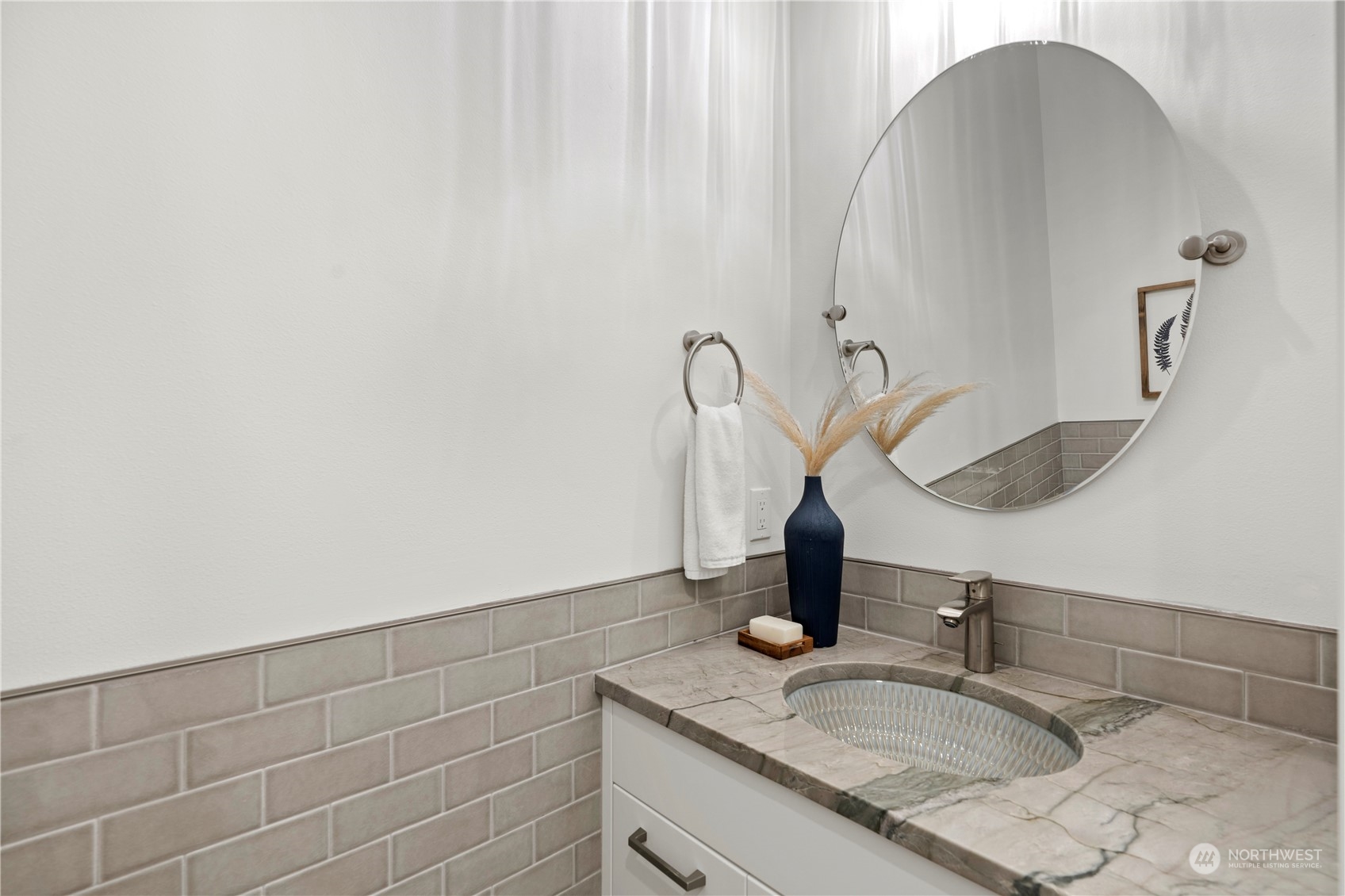 10063 Dibble Avenue Northwest Seattle, WA 98177 - Photo 20 of 35 a bathroom with a sink and vanity