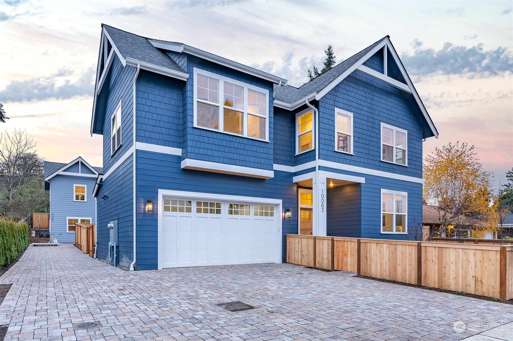 10063 Dibble Avenue Northwest Seattle, WA 98177 - Photo 2 of 35 a front view of a house with a yard and garage