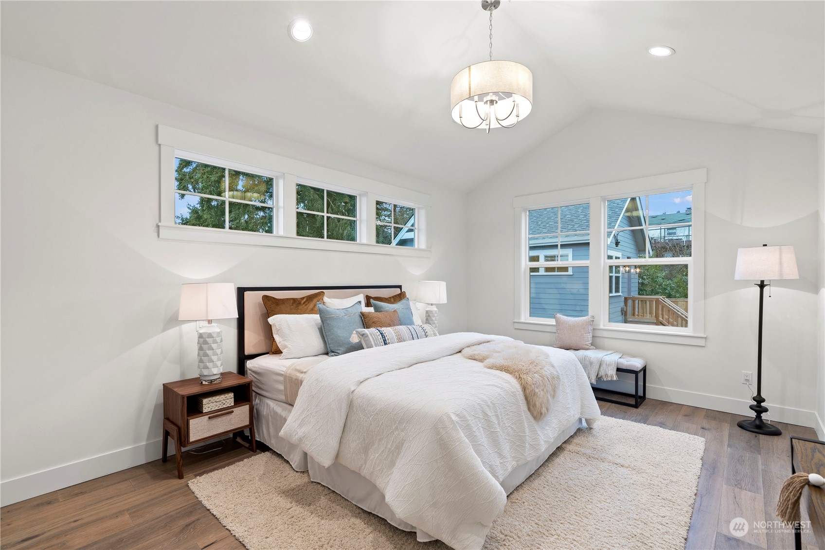 10063 Dibble Avenue Northwest Seattle, WA 98177 - Photo 22 of 35 a bedroom with a large bed and a window