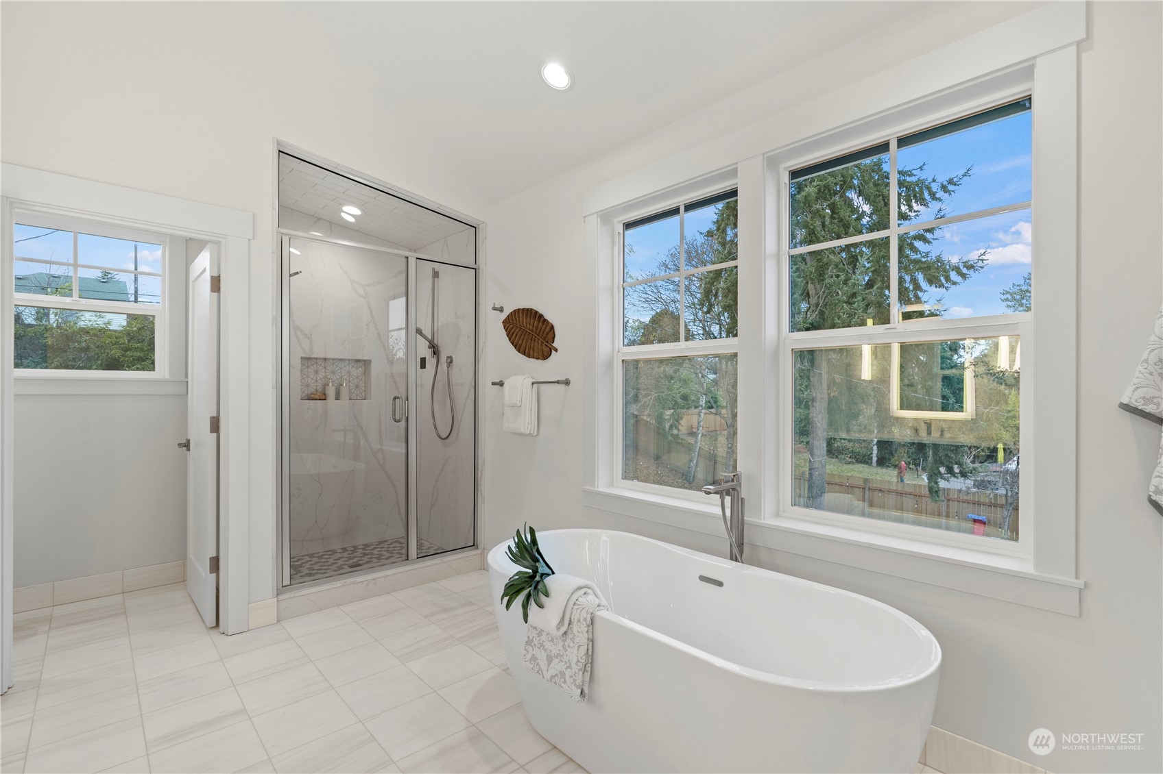 10063 Dibble Avenue Northwest Seattle, WA 98177 - Photo 25 of 35 a white bath tub sitting next to a shower