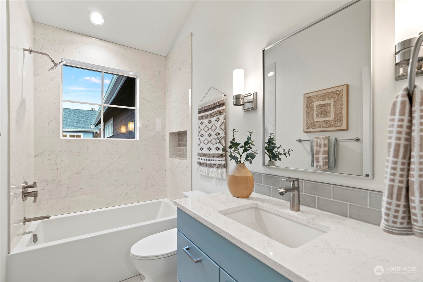 10063 Dibble Avenue Northwest Seattle, WA 98177 - Photo 27 of 35 a bathroom with a granite countertop sink a toilet and shower