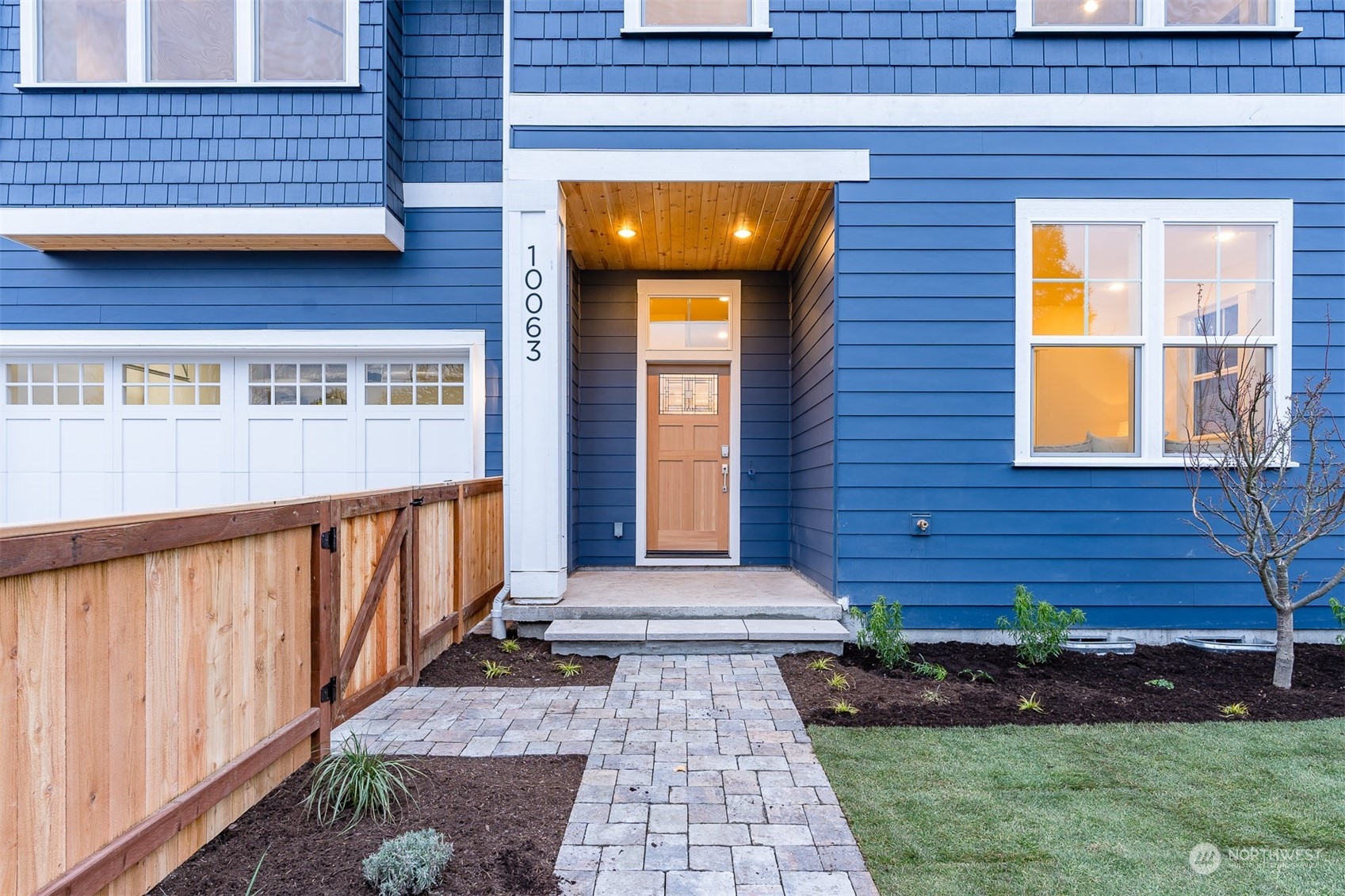 10063 Dibble Avenue Northwest Seattle, WA 98177 - Photo 4 of 35 a front view of a house with a yard