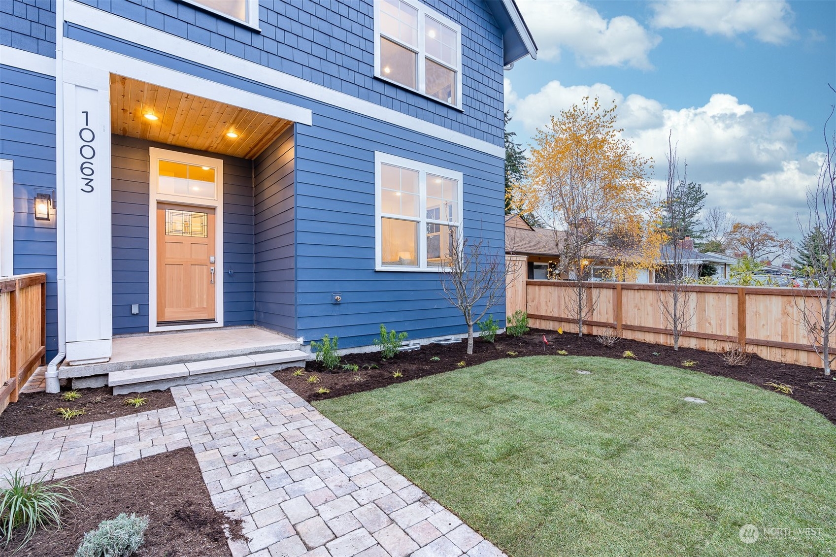 10063 Dibble Avenue Northwest Seattle, WA 98177 - Photo 5 of 35 a view of a house with a yard and wooden fence