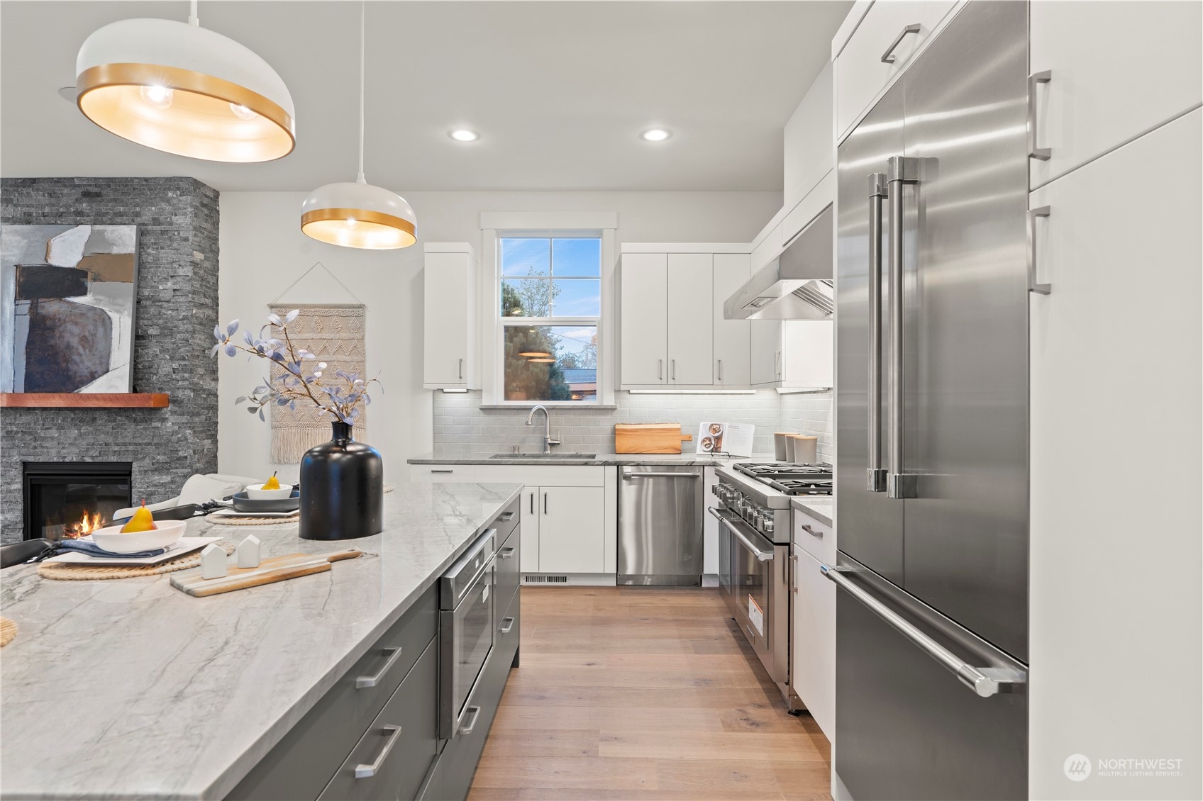 10063 Dibble Avenue Northwest Seattle, WA 98177 - Photo 7 of 35 a kitchen with cabinets and stainless steel appliances