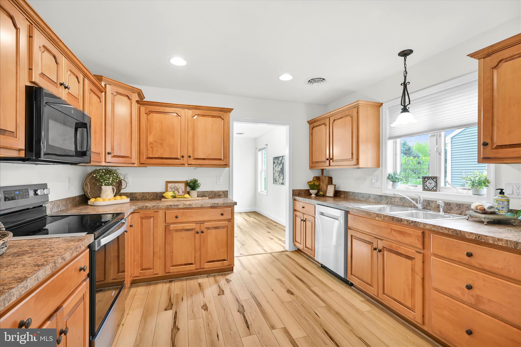 1029 Alden Way Lebanon, PA 17042 - Photo 25 of 59 a kitchen with stainless steel appliances granite countertop wooden cabinets a stove top oven a sink and dishwasher with wooden floor