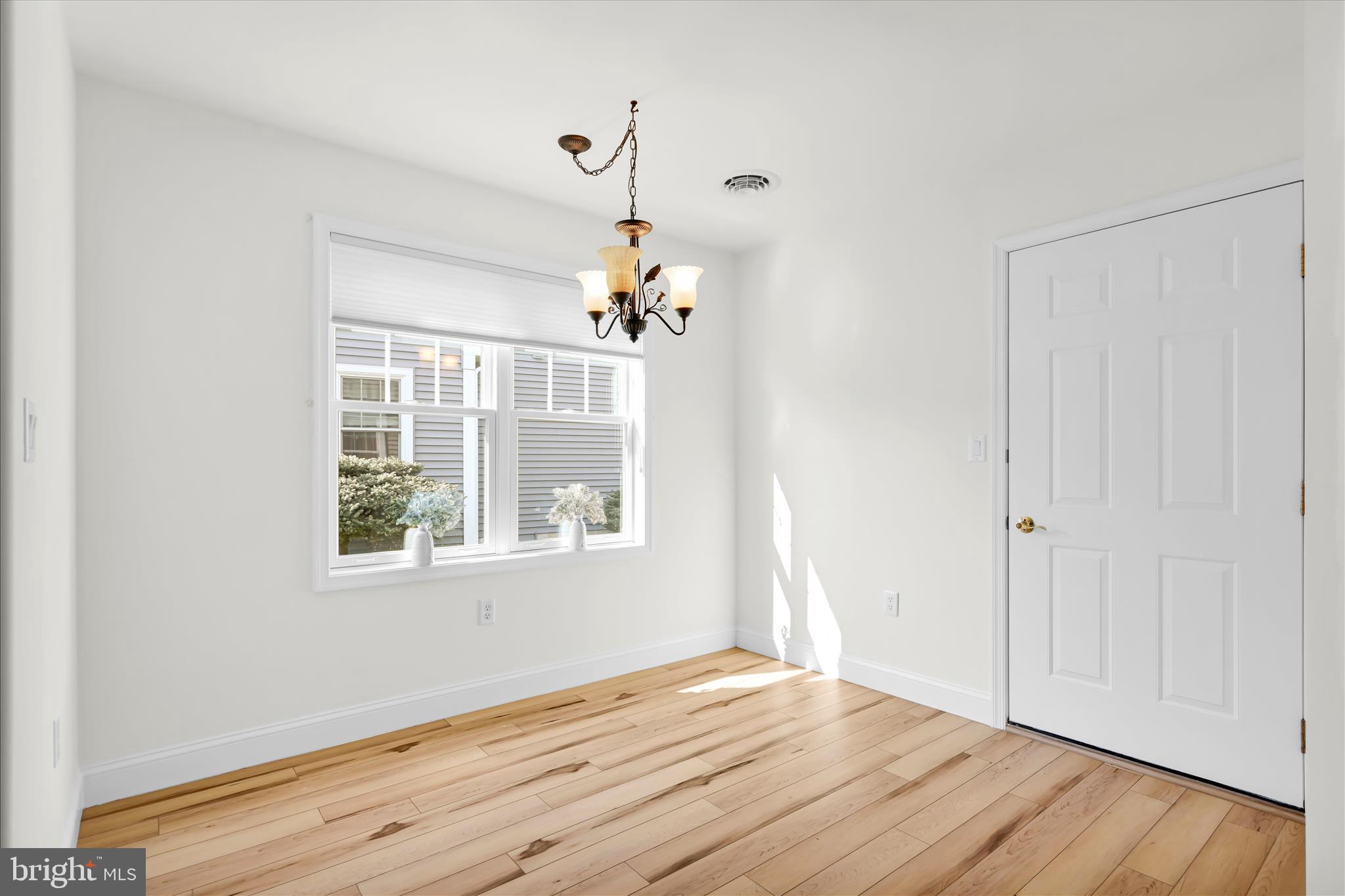 1029 Alden Way Lebanon, PA 17042 - Photo 27 of 59 a view of an empty room with wooden floor and a window