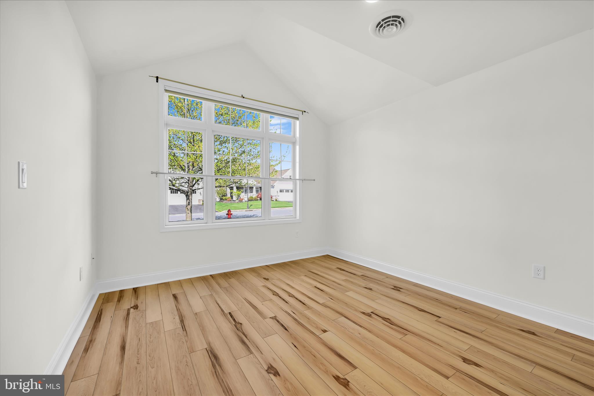 1029 Alden Way Lebanon, PA 17042 - Photo 32 of 59 a view of an empty room with wooden floor and a window
