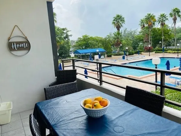 a swimming pool with chairs