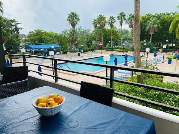 a view of a bench and yard in back