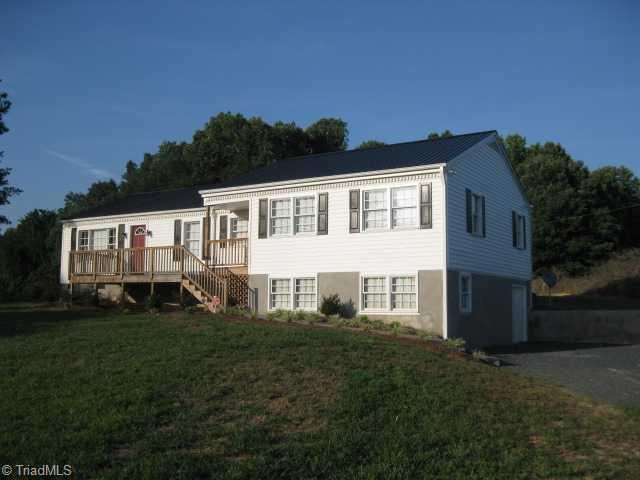 7677 Zion Church Road Staley, NC 27355 - Photo 2 of 10 Exterior Front. Second veiw showing the basement entry and large drive.