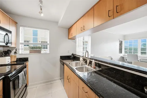 a kitchen that has a sink and a stove