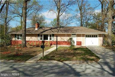8801 Littlewood Road Baltimore, MD 21234 - Photo 1 of 17 a house with trees in front of it