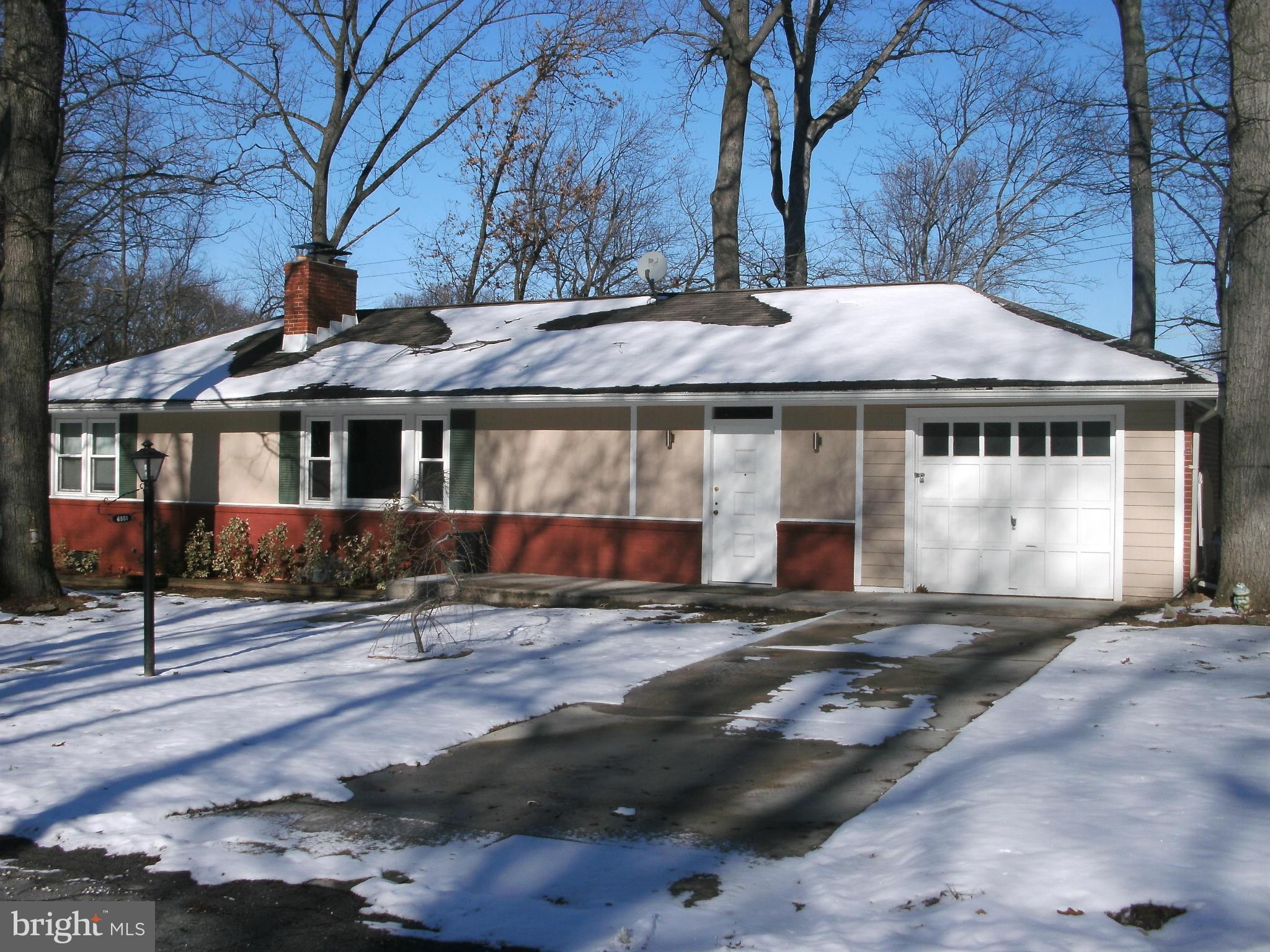 8801 Littlewood Road Baltimore, MD 21234 - Photo 3 of 17 a front view of a house with a yard