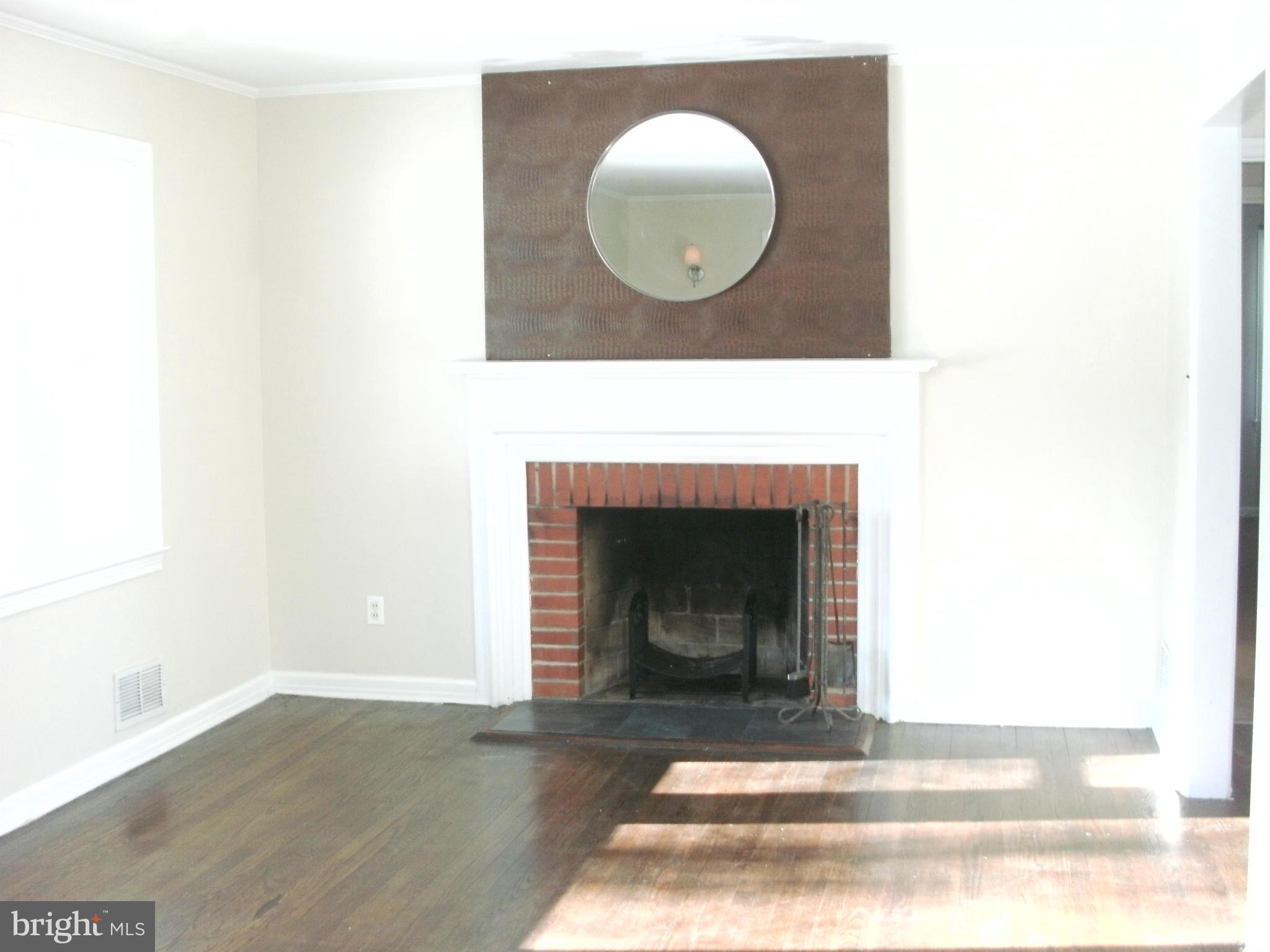 8801 Littlewood Road Baltimore, MD 21234 - Photo 6 of 17 a living room with a fireplace